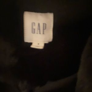 Small black faux fur jacket.  Adorable.